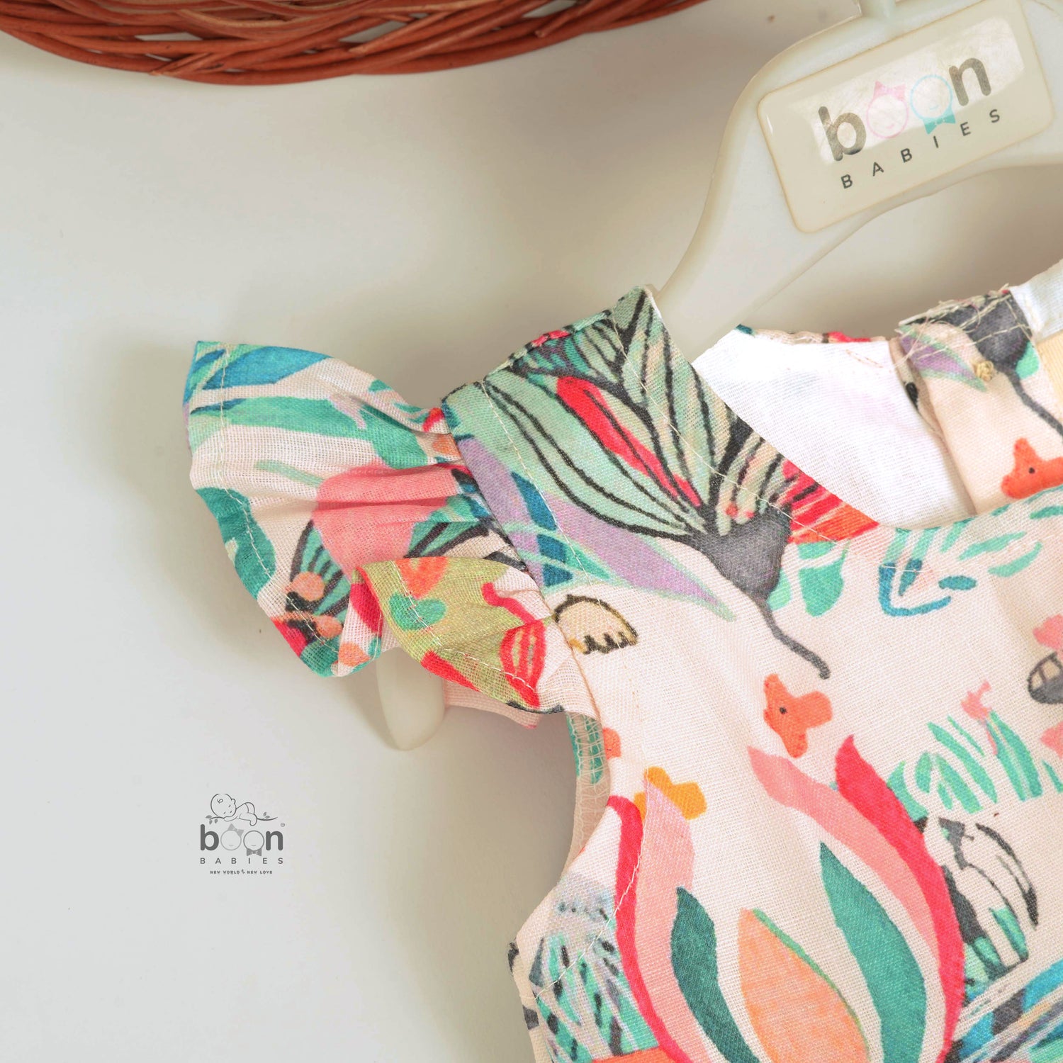 Bright floral cotton frock with cap sleeves for girls aged 6M to 5Y. Made for play, twirls & tropical fun!
