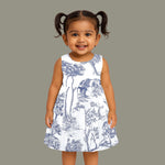 Toddler girl wearing a white and blue sleeveless cotton frock with forest and elephant print – soft summer wear from Boon Babies, Coimbatore.