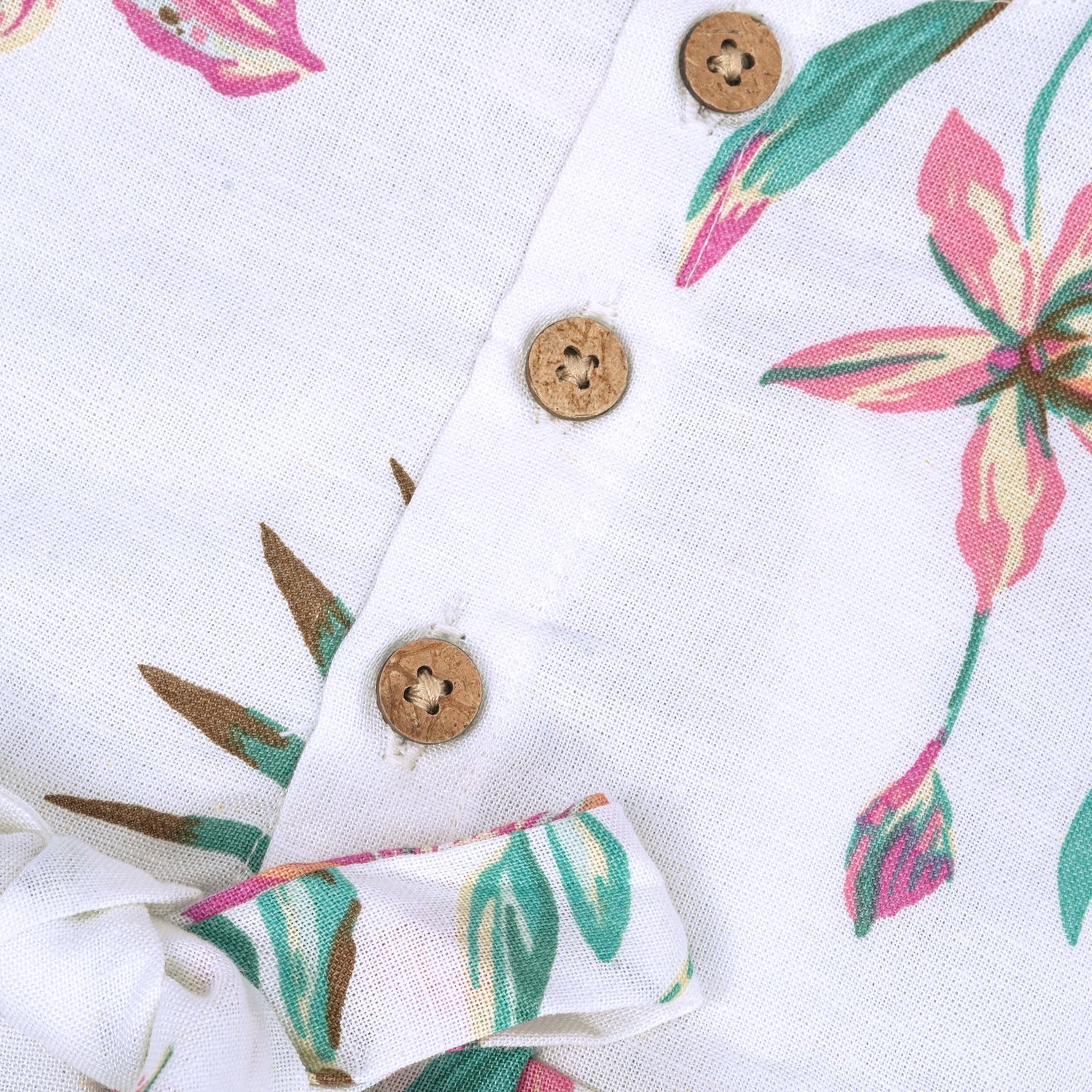 Toddler girl in a white sleeveless frock with navy blue and pink forest animal print – pure cotton summer dress from Boon Babies, Coimbatore.