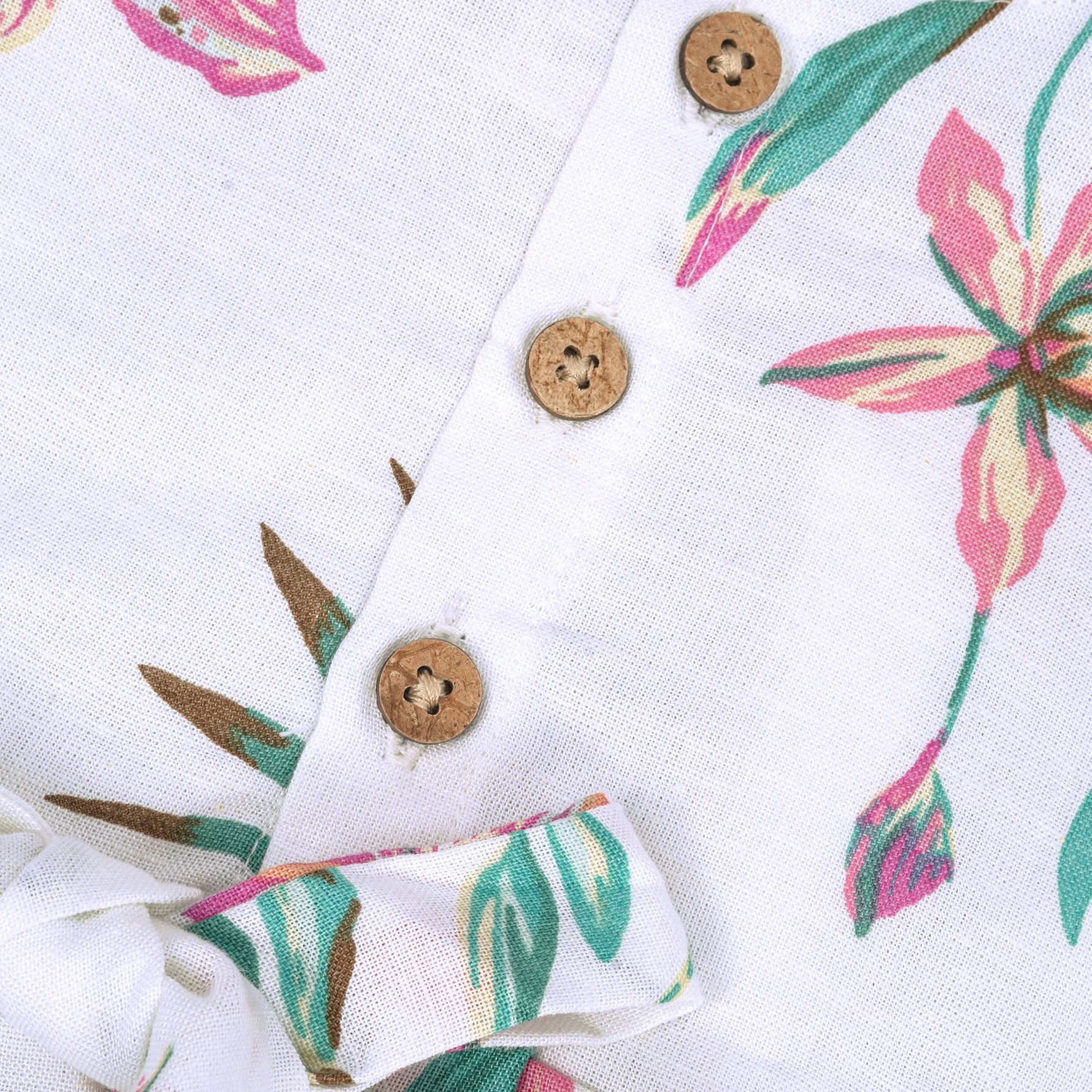 Toddler girl in a white sleeveless frock with navy blue and pink forest animal print – pure cotton summer dress from Boon Babies, Coimbatore.