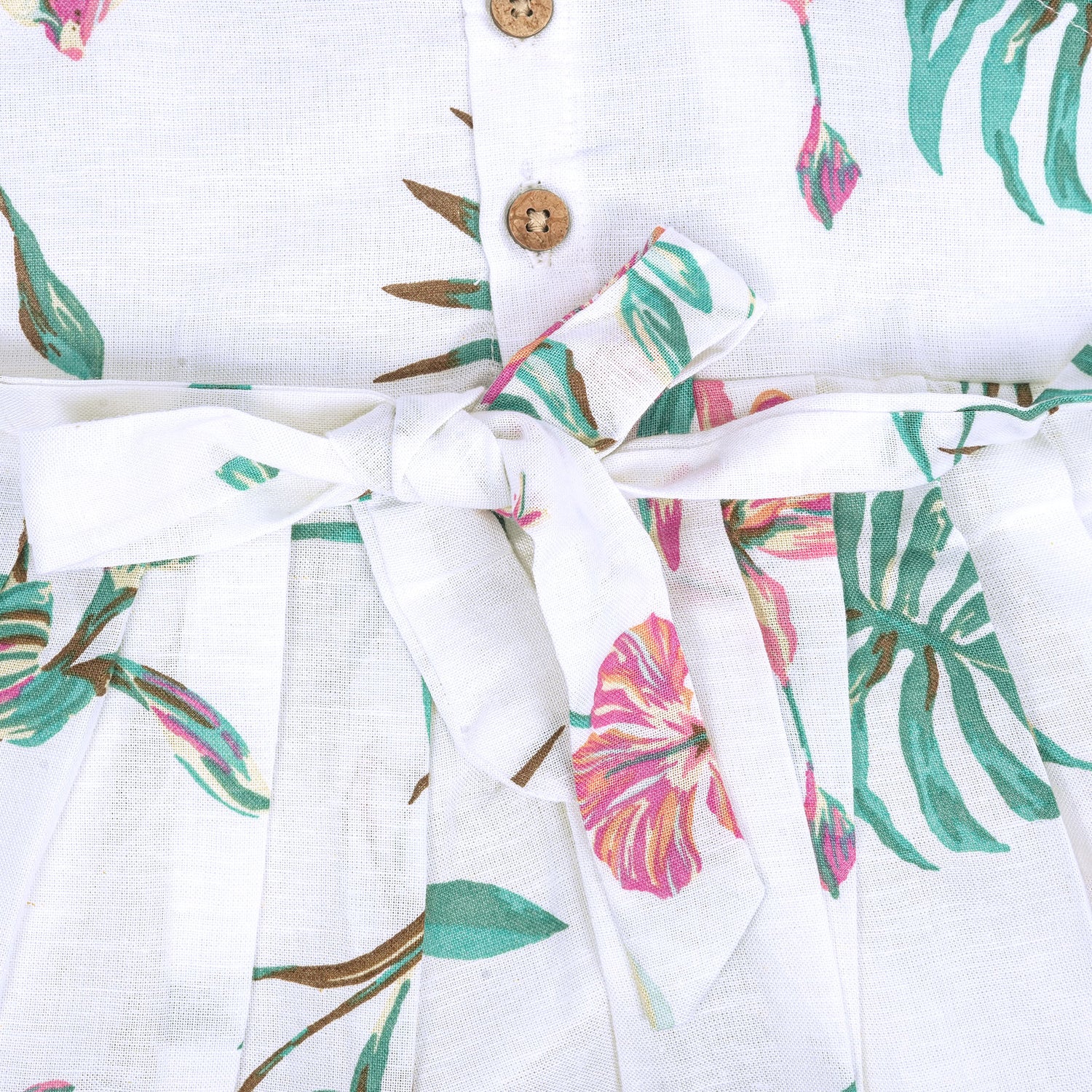 Toddler girl in a white sleeveless frock with navy blue and pink forest animal print – pure cotton summer dress from Boon Babies, Coimbatore.