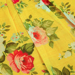 Cheerful yellow floral frock in soft linen with frill sleeves. Ages 6 months to 4 years. Summer-perfect wear for baby girls.
