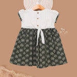 Girls printed leaf frock in olive green cotton for kids, featuring charming design by Boon Babies for ages 6 to 12 years.