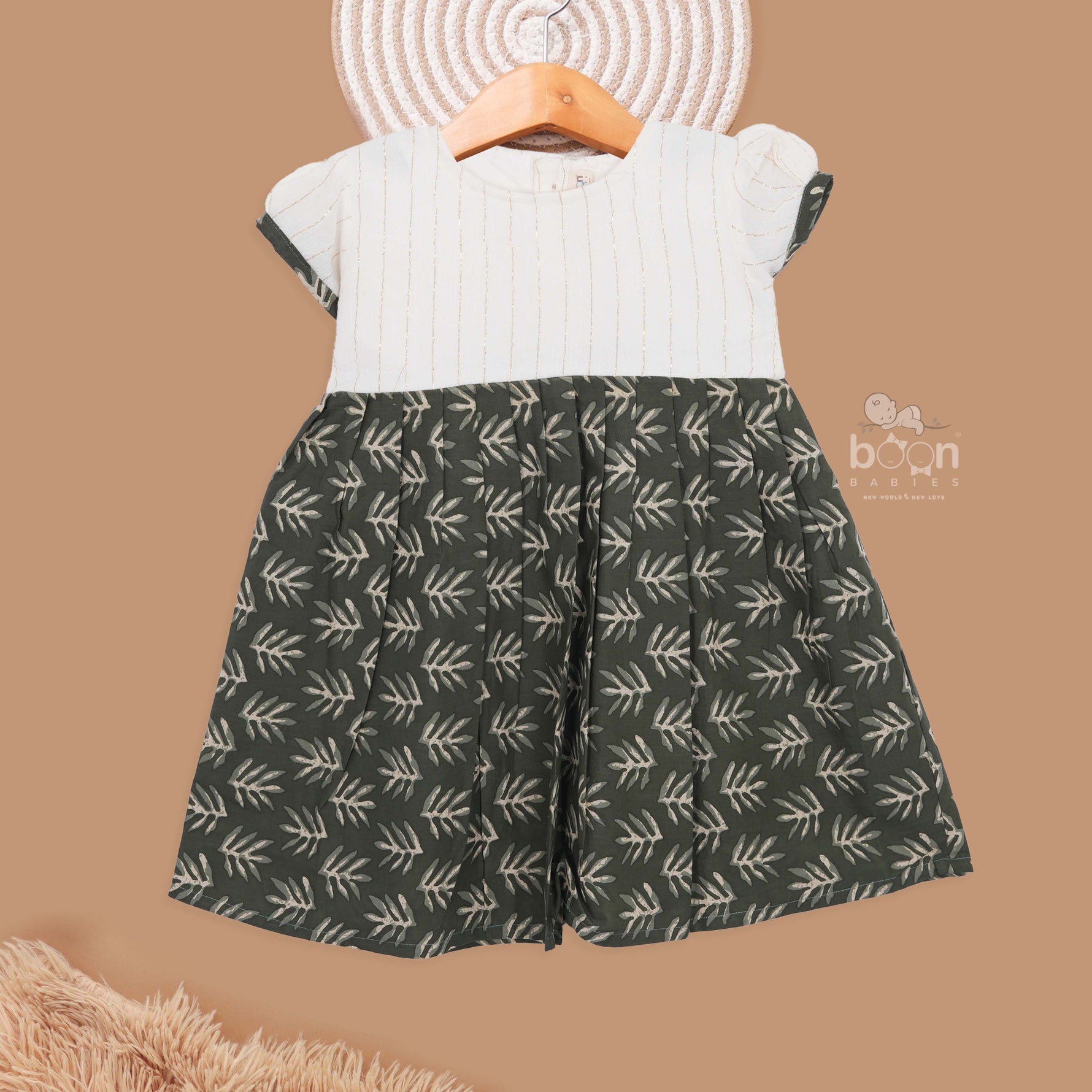 Girls' olive green cotton leaf print frock from Boon Babies, charming kids' girls printed frock for ages 6-12 years.