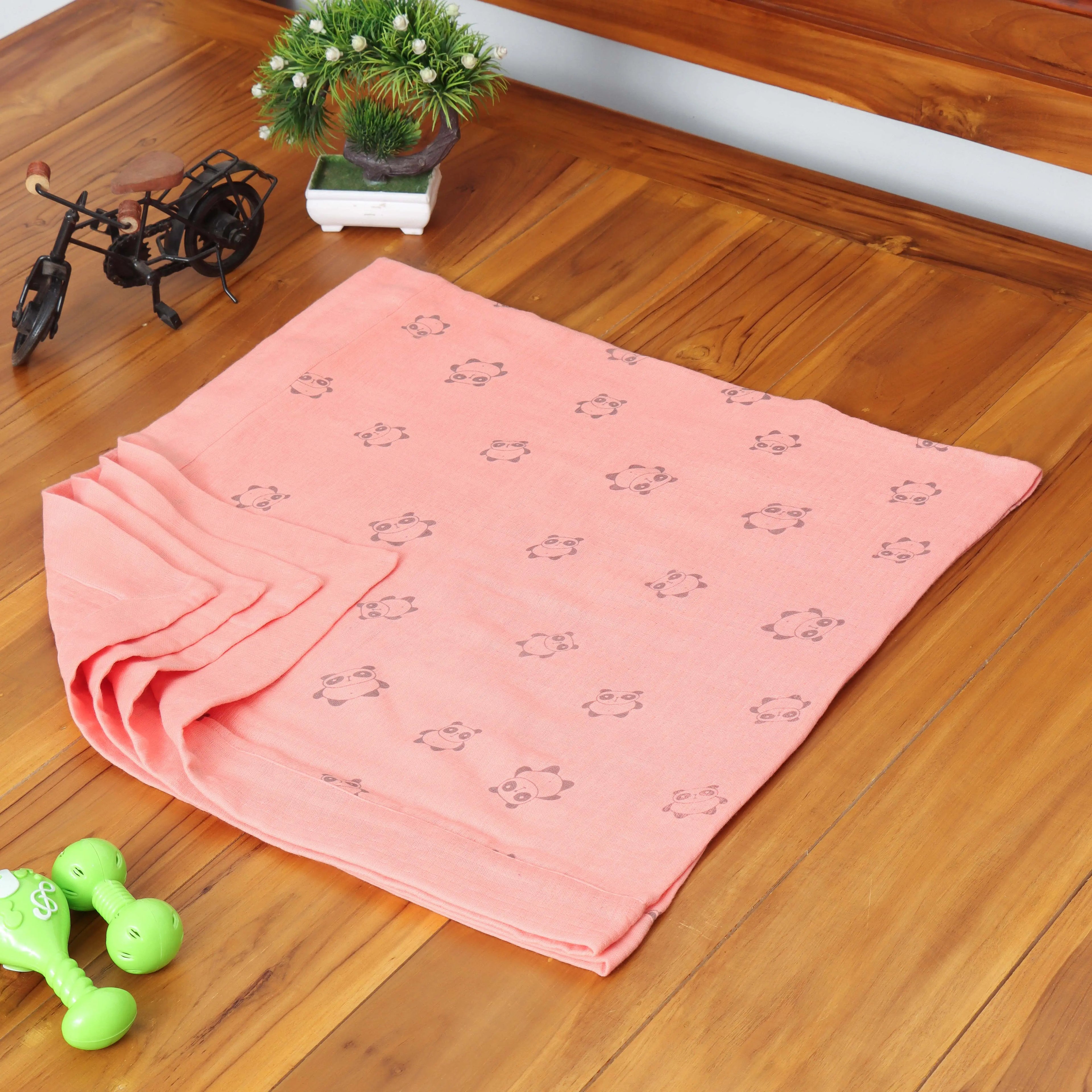 Colorful Boon Babies Doodle Dreams 6-layer printed muslin blanket with fun animal prints, perfect for babies.