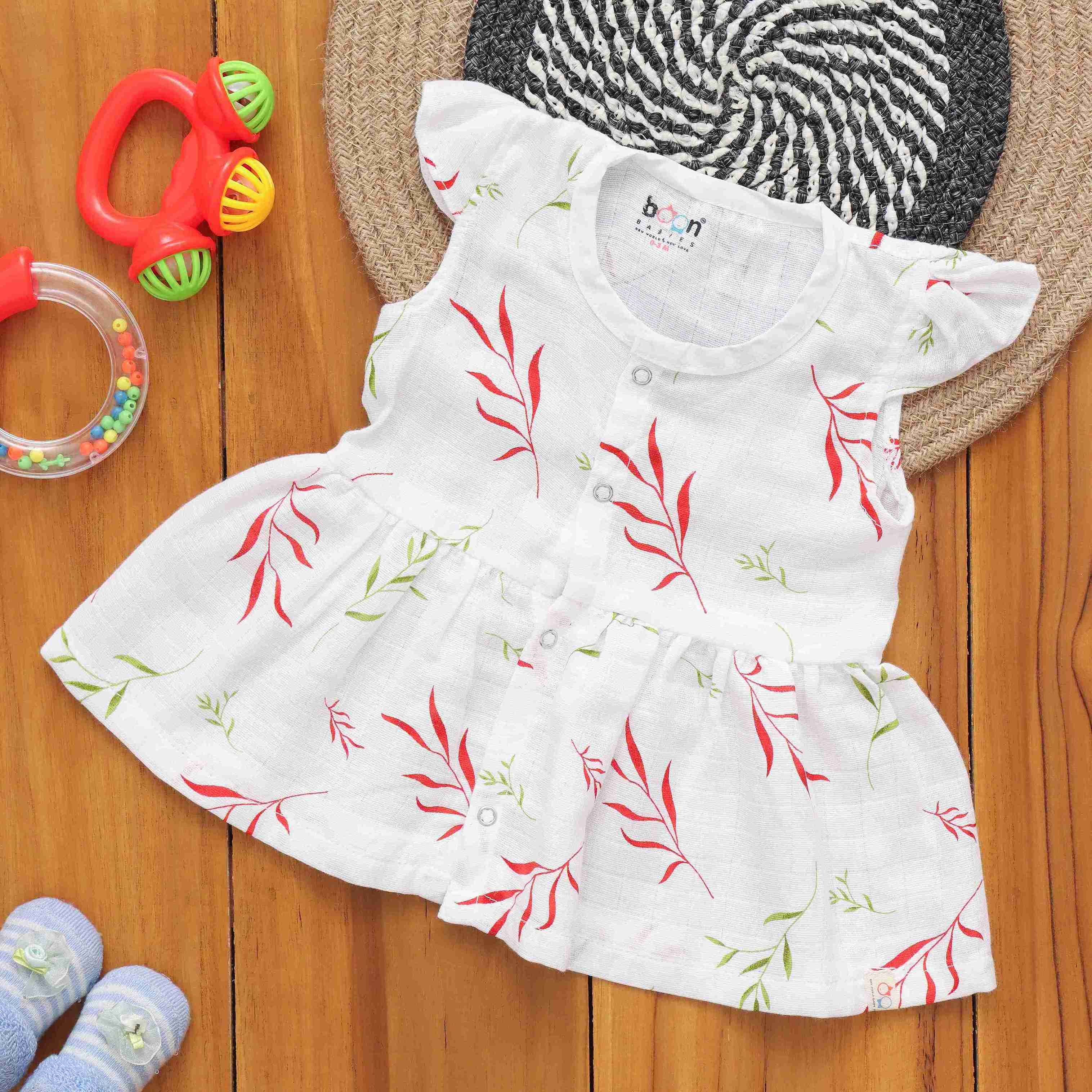Printed leafy design capsleeve muslin baby frock by Boon Babies, 2-layer natural fabric, suitable for 3-month-old infants.