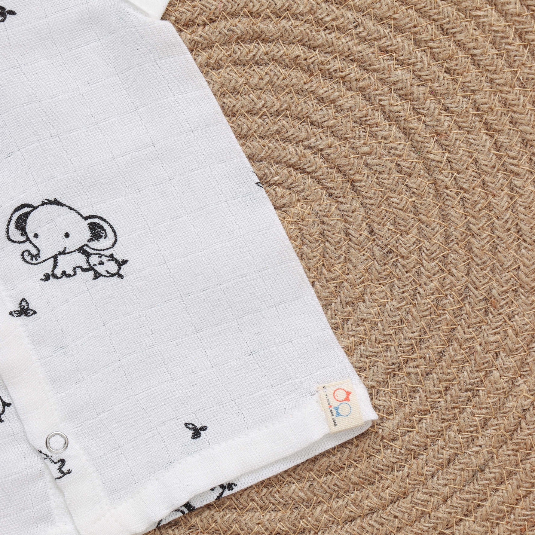 Organic muslin babywear with elephant print, soft and breathable printed jabla for infants by Boon Babies.