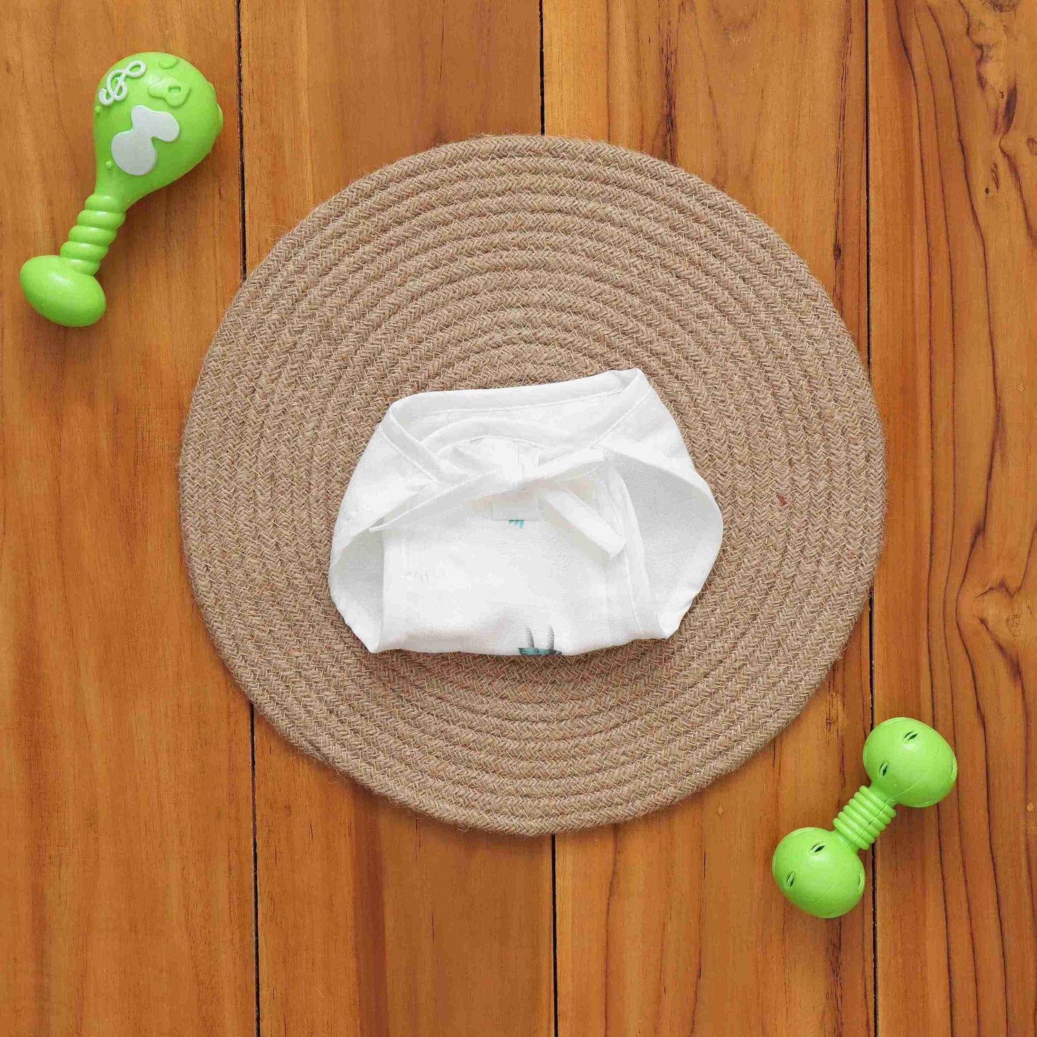 White muslin baby nappy with bunny print. For 0–3 months. Soft, reusable, and skin-friendly with easy tie closure.