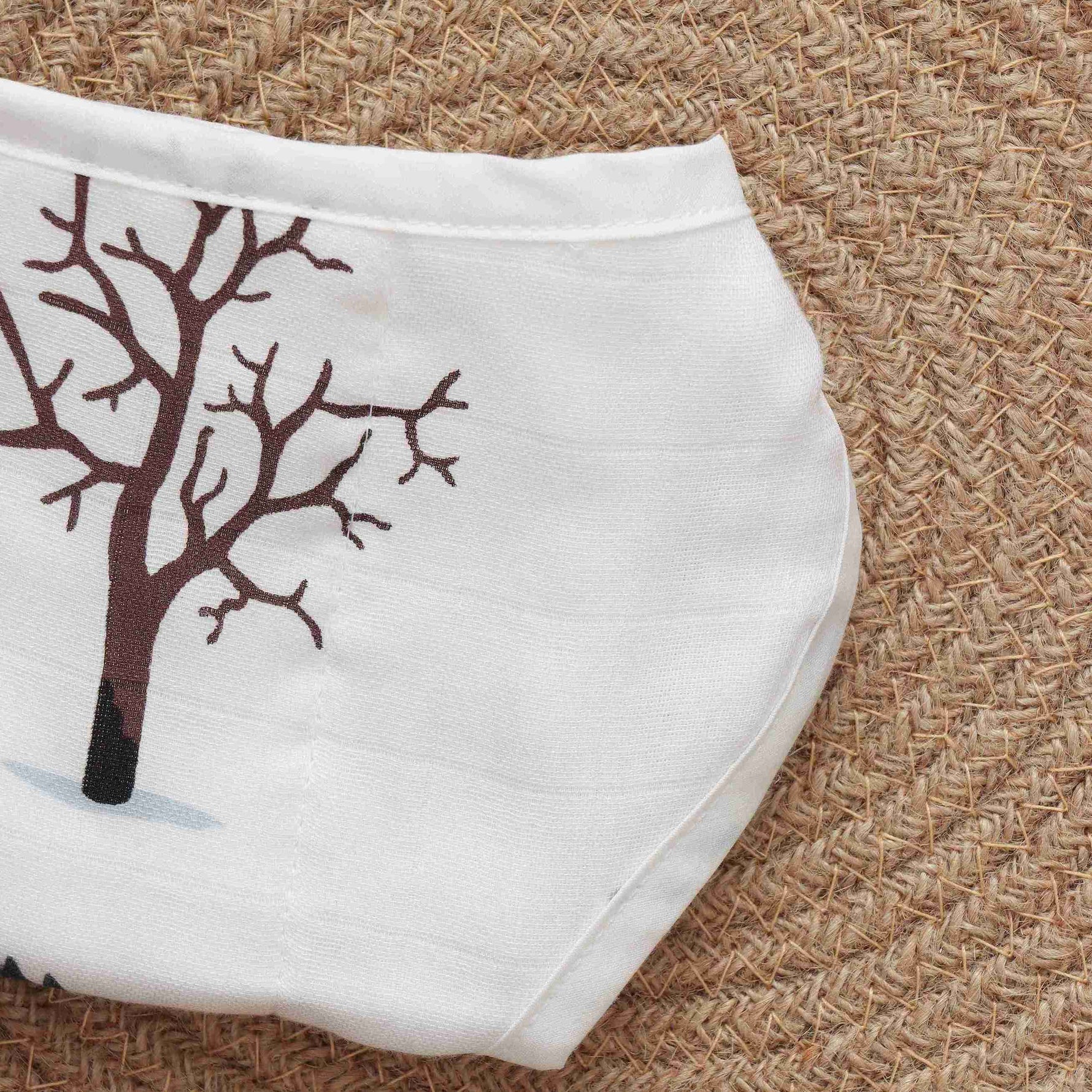 Soft muslin baby nappy with cute forest animal print. Size 0–3 months. Reusable, breathable, and tie-up style for a gentle fit.
