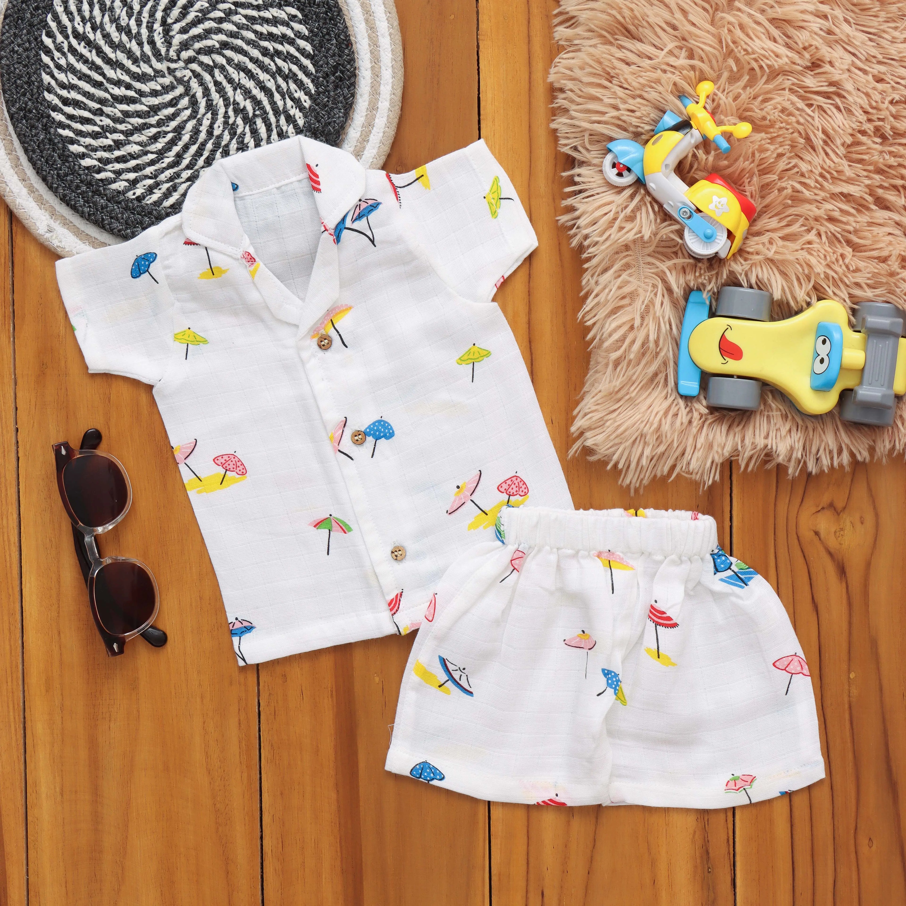 Cute boys' playtime set with printed open-collar shirt and matching shorts from Boon Babies, designed for 4-6 months.