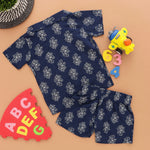 Navy blue floral printed boys' shirt and shorts set with open collar from Boon Babies, featuring colorful flower prints for trendy kids.
