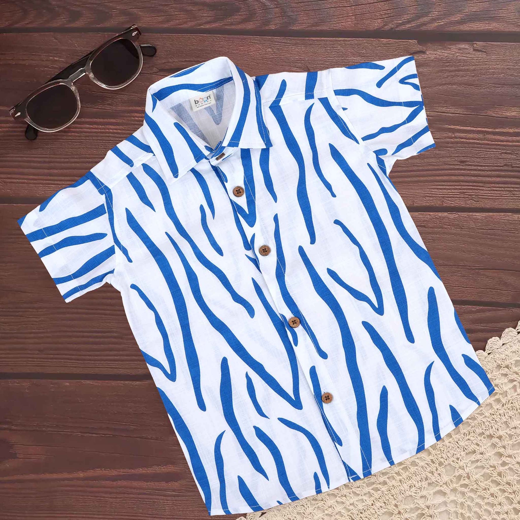 Boys cotton printed shirt by Boon Babies with blue and white wavy stripes, straight collar, suitable for ages 6-12 months.