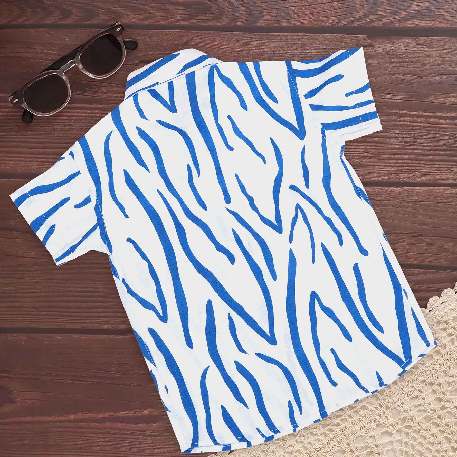 Boys cotton printed shirt by Boon Babies with blue and white wavy stripe pattern, straight collar, suitable for 6-12 months.