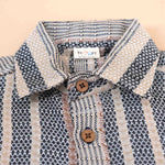 Red tribal-inspired print boys' cotton shirt with straight collar by Boon Babies, featuring vibrant tribal pattern on soft cotton fabric.