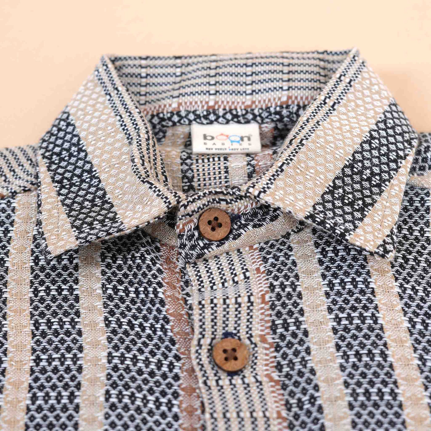Red tribal-inspired print boys' cotton shirt with straight collar by Boon Babies, featuring vibrant tribal pattern on soft cotton fabric.