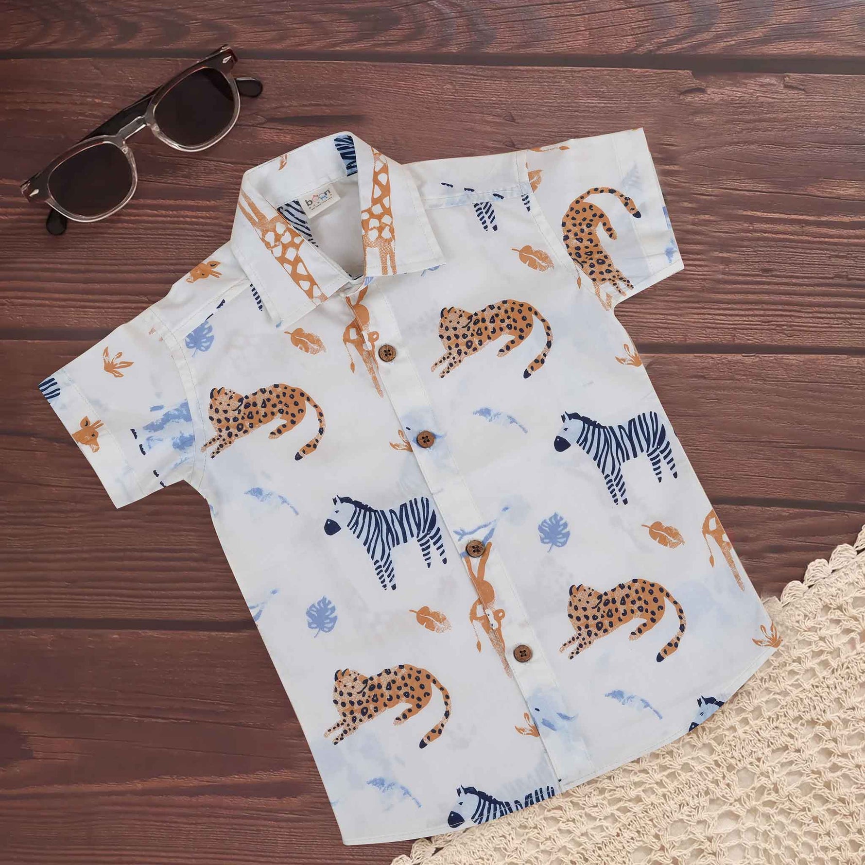 Boys cotton shirt with jungle animal safari print, straight collar, white breathable cotton fabric, by Boon Babies for ages 6-12 months.