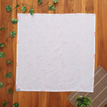 Soft muslin baby towel with red & green leaf print. 70x70 cm. Gentle on skin, perfect for newborn care.