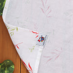 Soft muslin baby towel with red & green leaf print. 70x70 cm. Gentle on skin, perfect for newborn care.