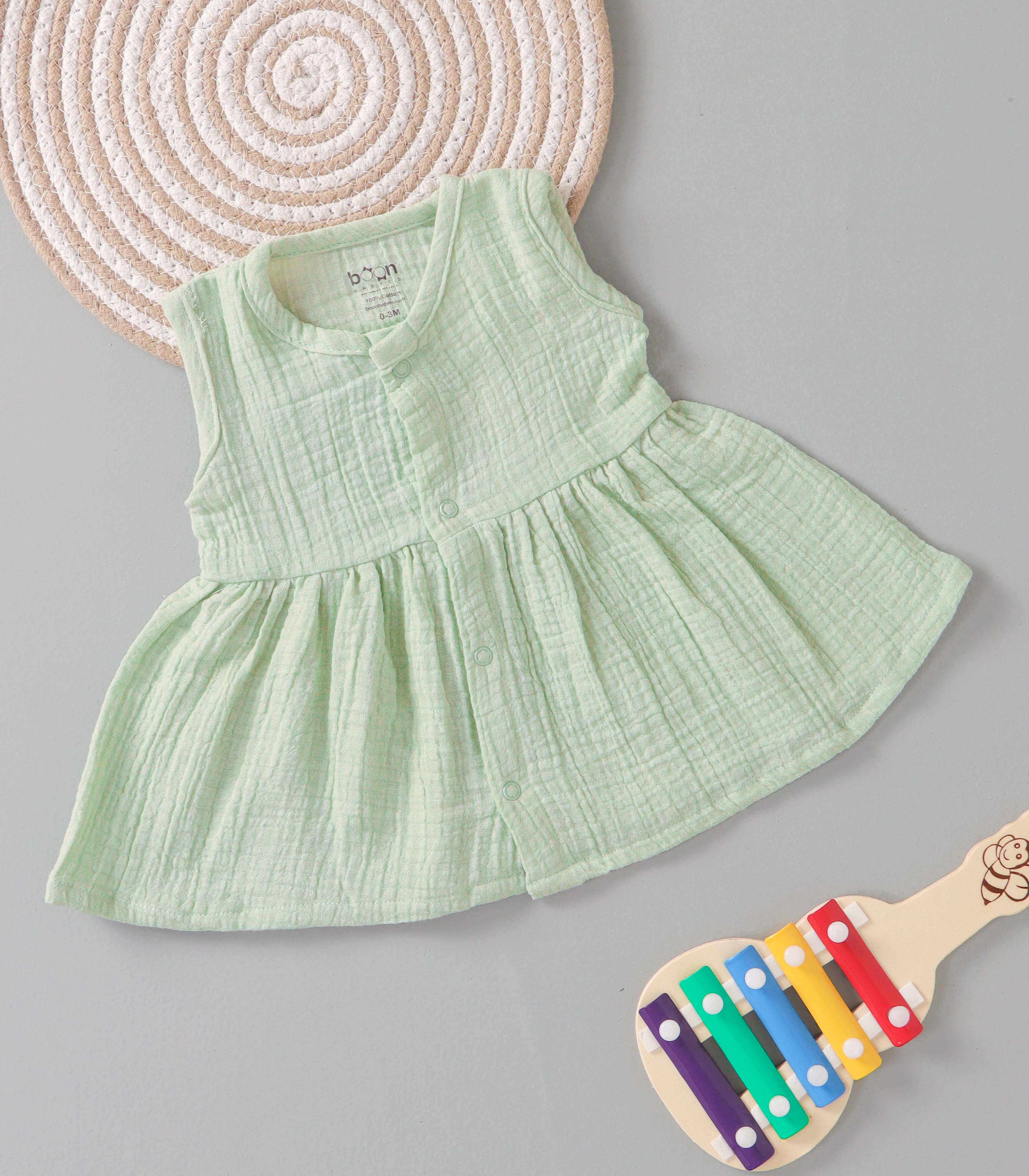 Mint Whisp crinkled muslin sleeveless baby frock by Boon Babies, solid pastel green frill dress for infants, soft and comfortable fabric.
