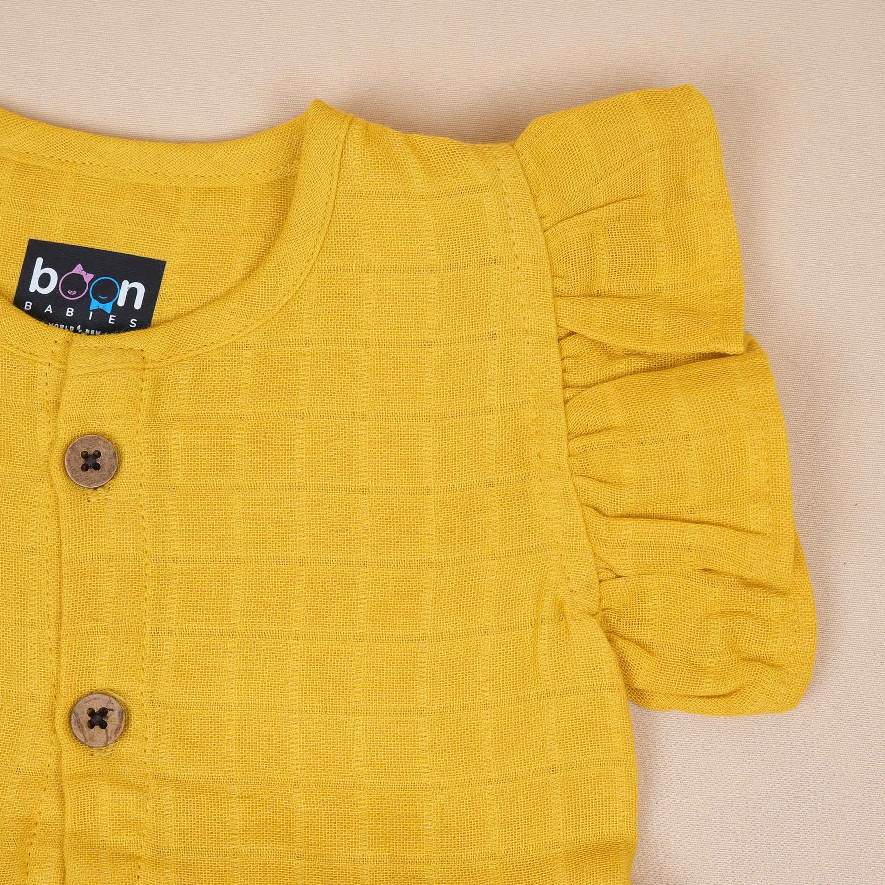 Mustard Muslin Baby Frock – Soft & Stylish with Wooden Buttons Boon Babies