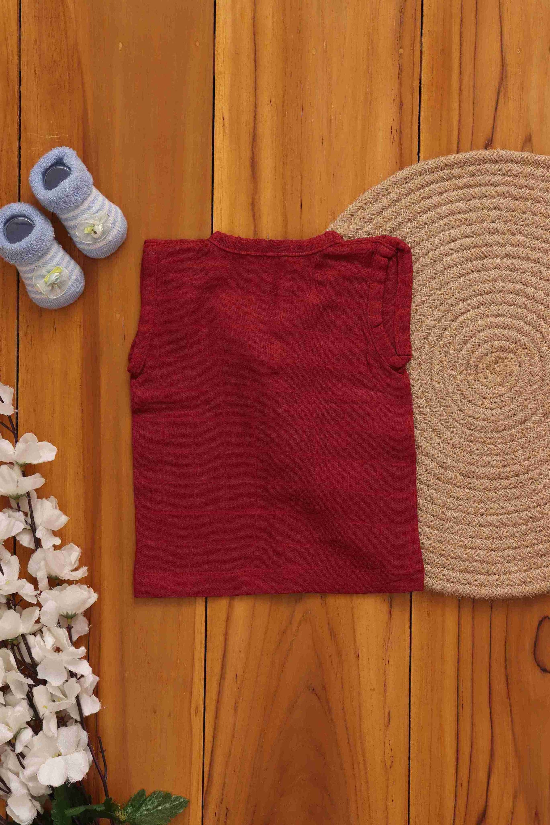 Elegant maroon two-layer muslin baby jabla by Boon Babies, showcasing soft, solid maroon fabric with a comfortable, layered design for infants.
