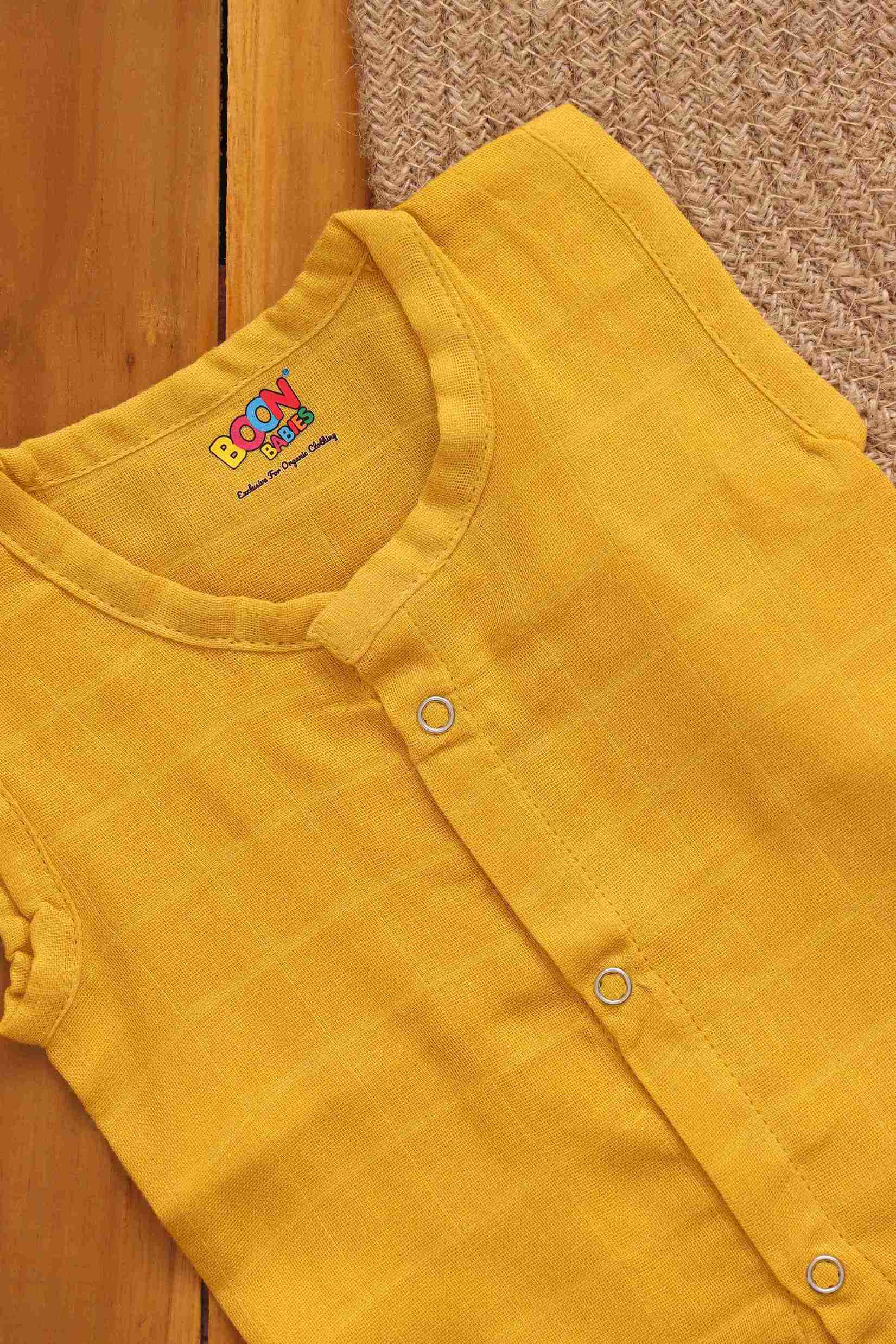 Soft muslin babywear in mustard yellow, solid Jabla by Boon Babies, two-layer eco-friendly baby clothing for 0-3 months.