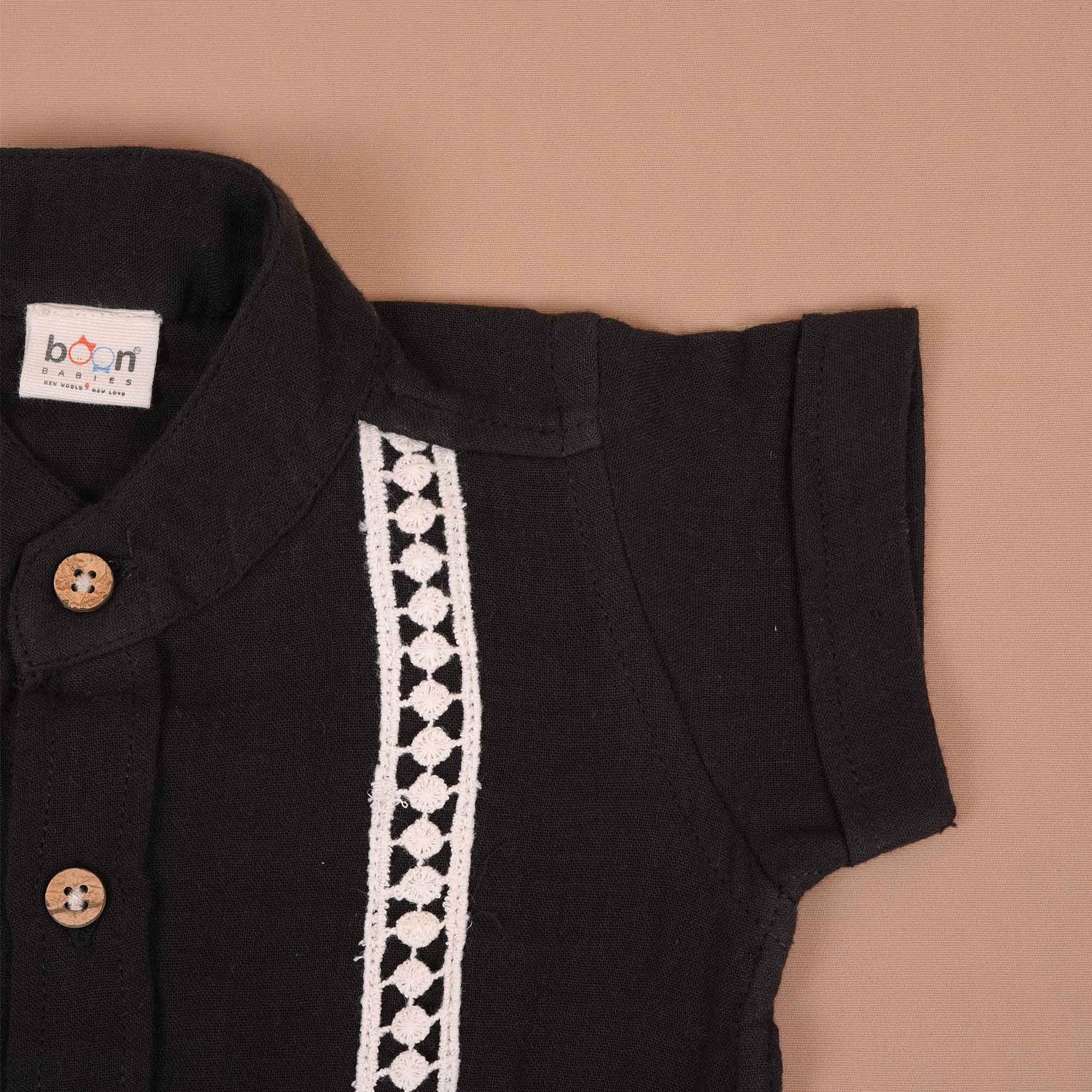 Boys black cotton crinkled muslin shirt with wooden buttons, solid style for babies, by Boon Babies.