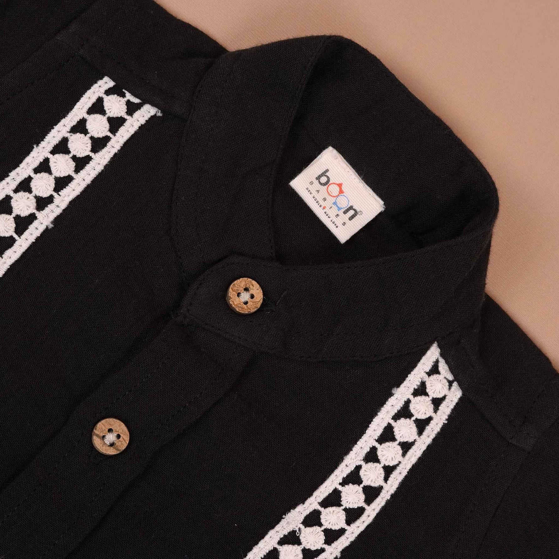 Boys black cotton crinkled muslin shirt with wooden buttons, solid design by Boon Babies for ages 6-12 months.