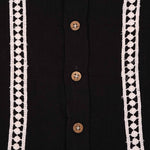 Boys black cotton crinkled muslin shirt with wooden buttons, solid design, by Boon Babies, suitable for infants aged 6-12 months.