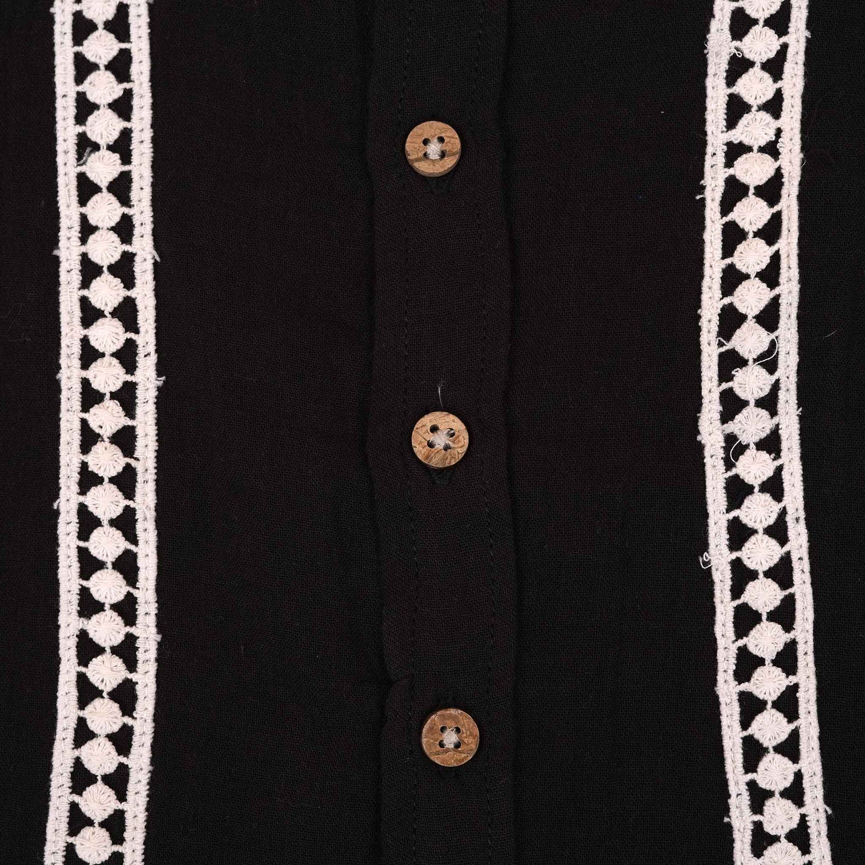 Boys black cotton crinkled muslin shirt with wooden buttons, solid design, by Boon Babies, suitable for infants aged 6-12 months.