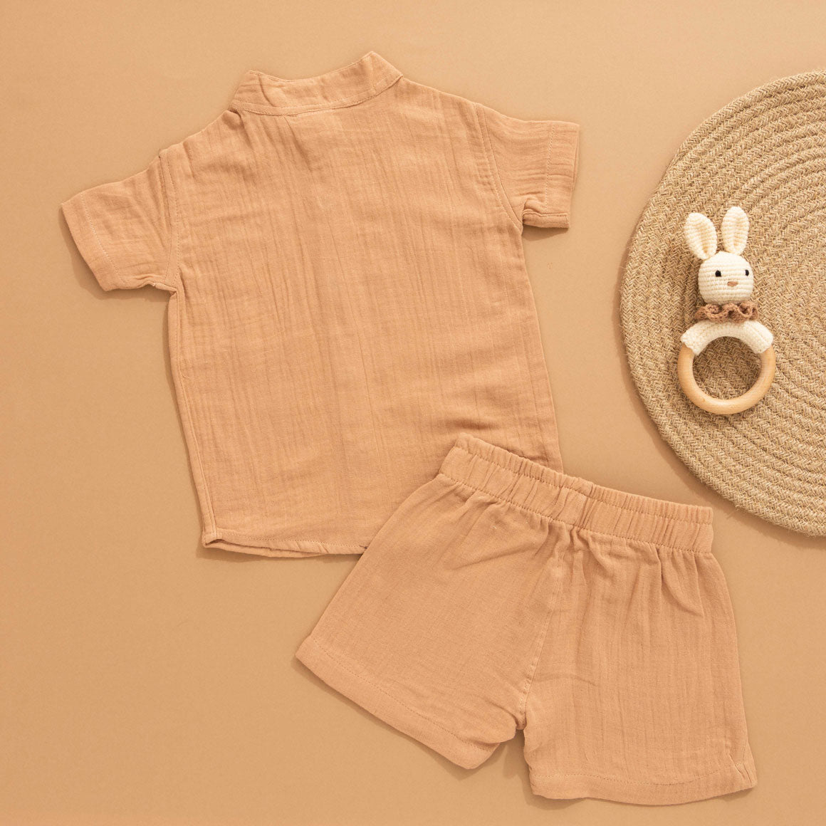 Camel beige boys muslin shirt and shorts set with hippo patch embroidery, Chinese collar, and wooden buttons – breathable summer outfit by Boon Babies.
