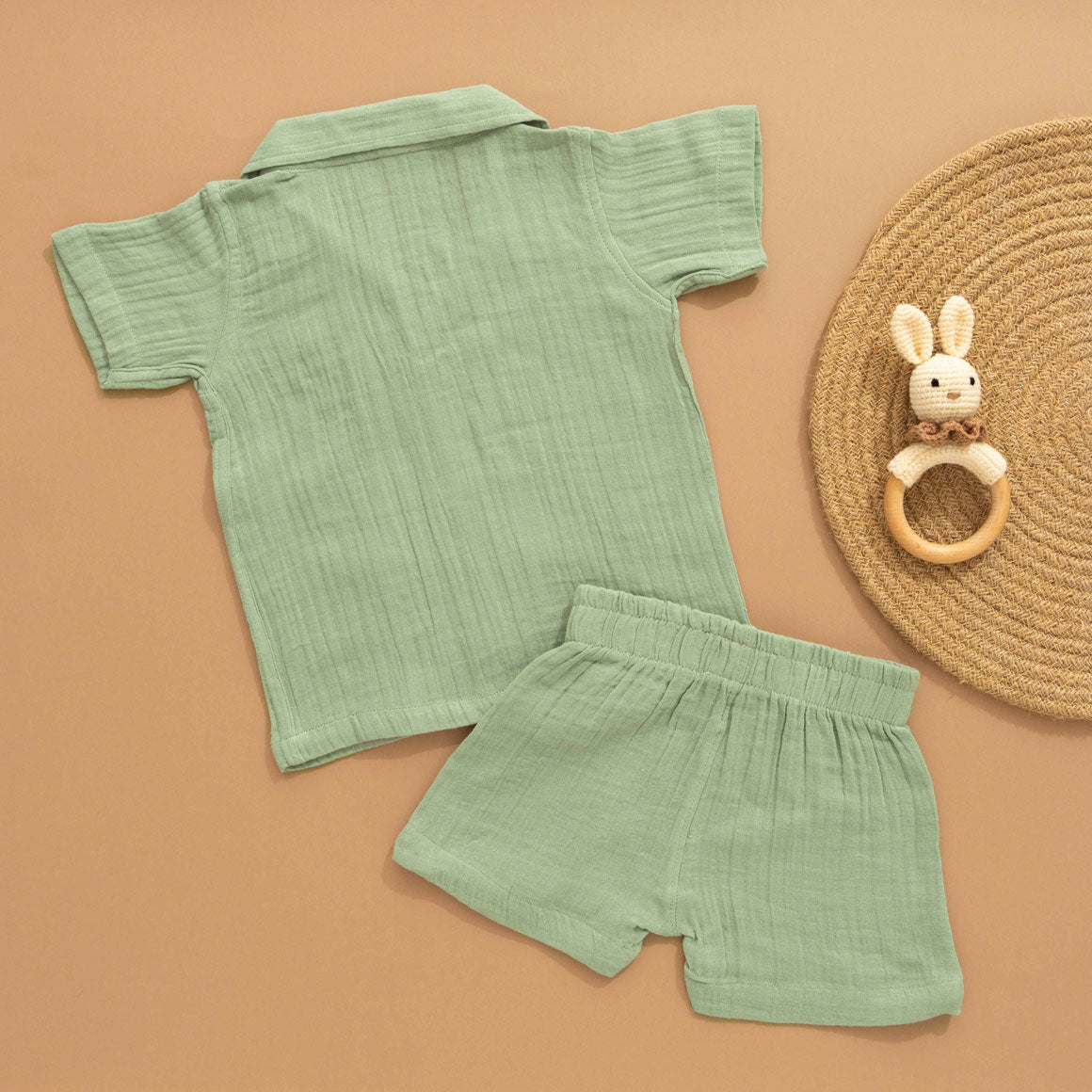 Mint green boys’ shirt and shorts co-ord set in crinkled muslin with panda embroidery and wooden buttons – from Boon Babies kidswear in Coimbatore.
