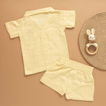 Light yellow boys shirt and shorts set in crinkled muslin with tiger patch and wooden buttons – breathable summer co-ord from Boon Babies.
