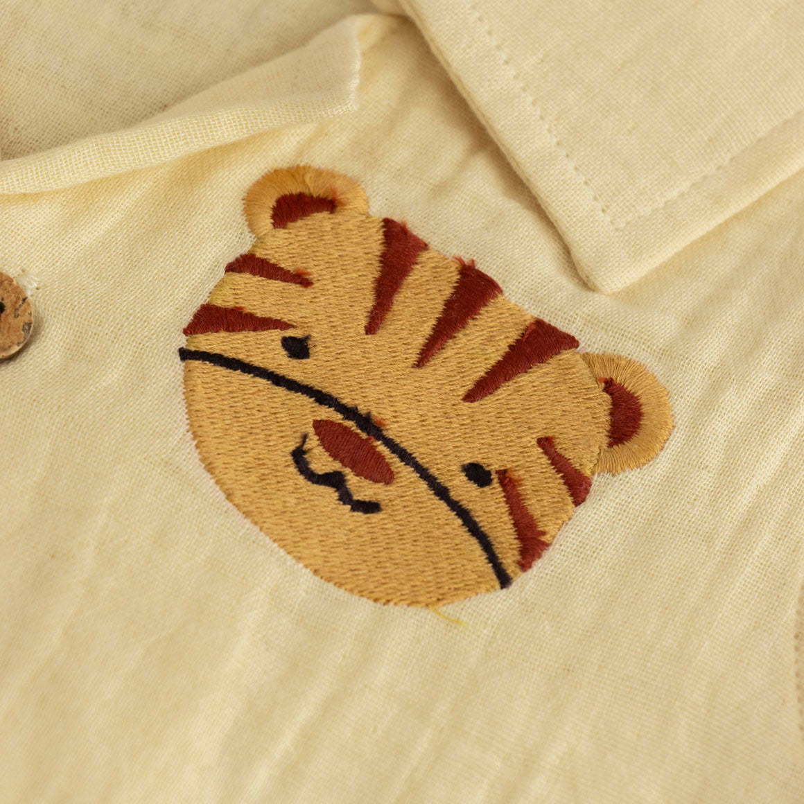 Light yellow boys shirt and shorts set in crinkled muslin with tiger patch and wooden buttons – breathable summer co-ord from Boon Babies.
