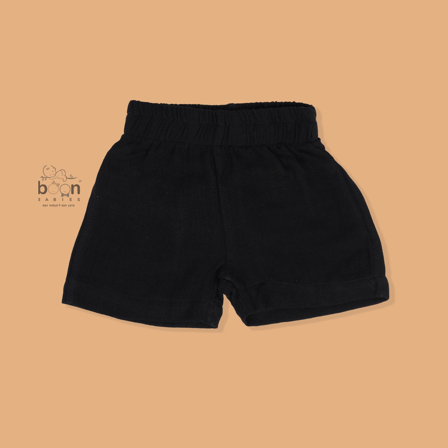 Black crinkle muslin shirt and shorts set for boys featuring lion face embroidery and wooden buttons – breathable toddler outfit by Boon Babies, Coimbatore.
