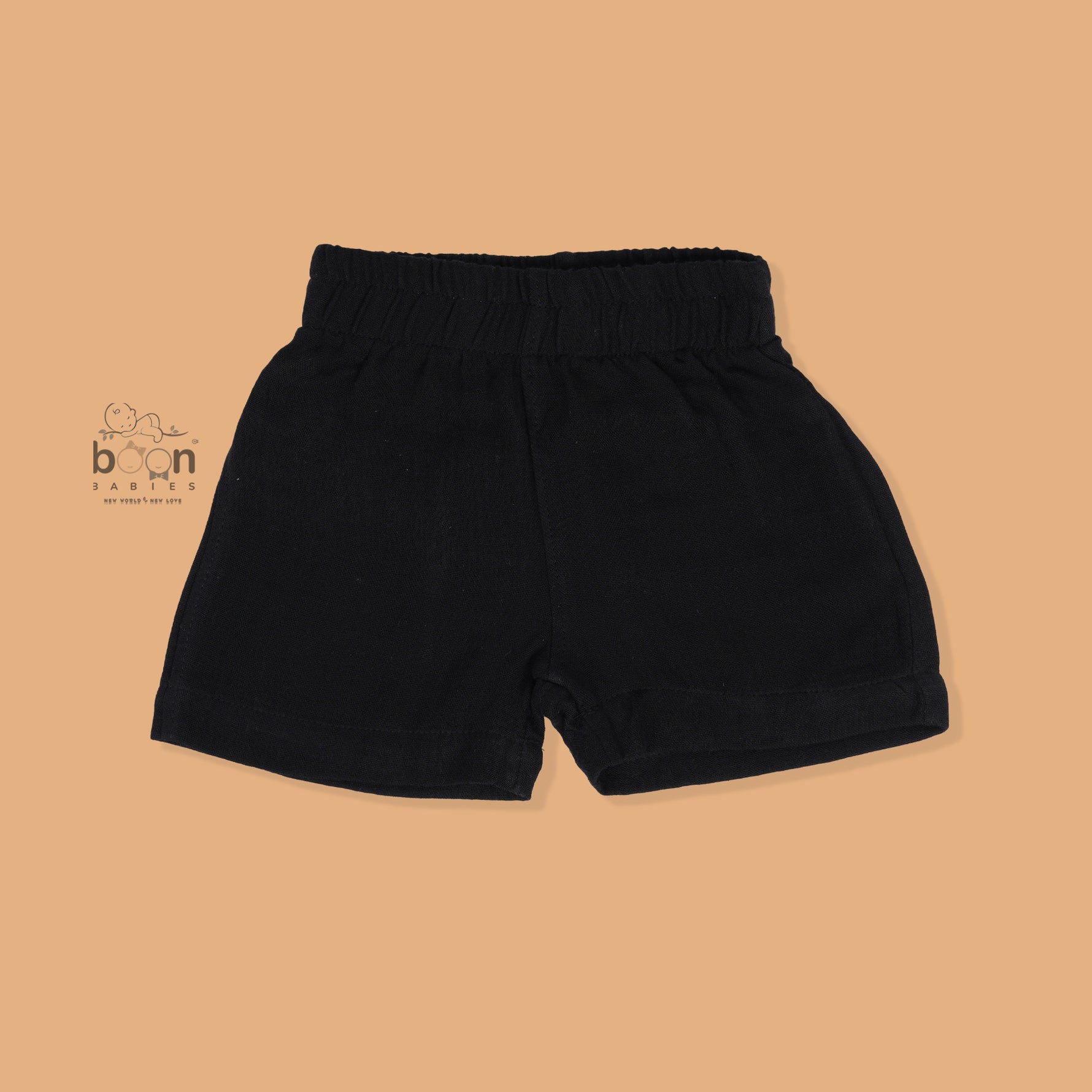 Black crinkle muslin shirt and shorts set for boys featuring lion face embroidery and wooden buttons – breathable toddler outfit by Boon Babies, Coimbatore.
