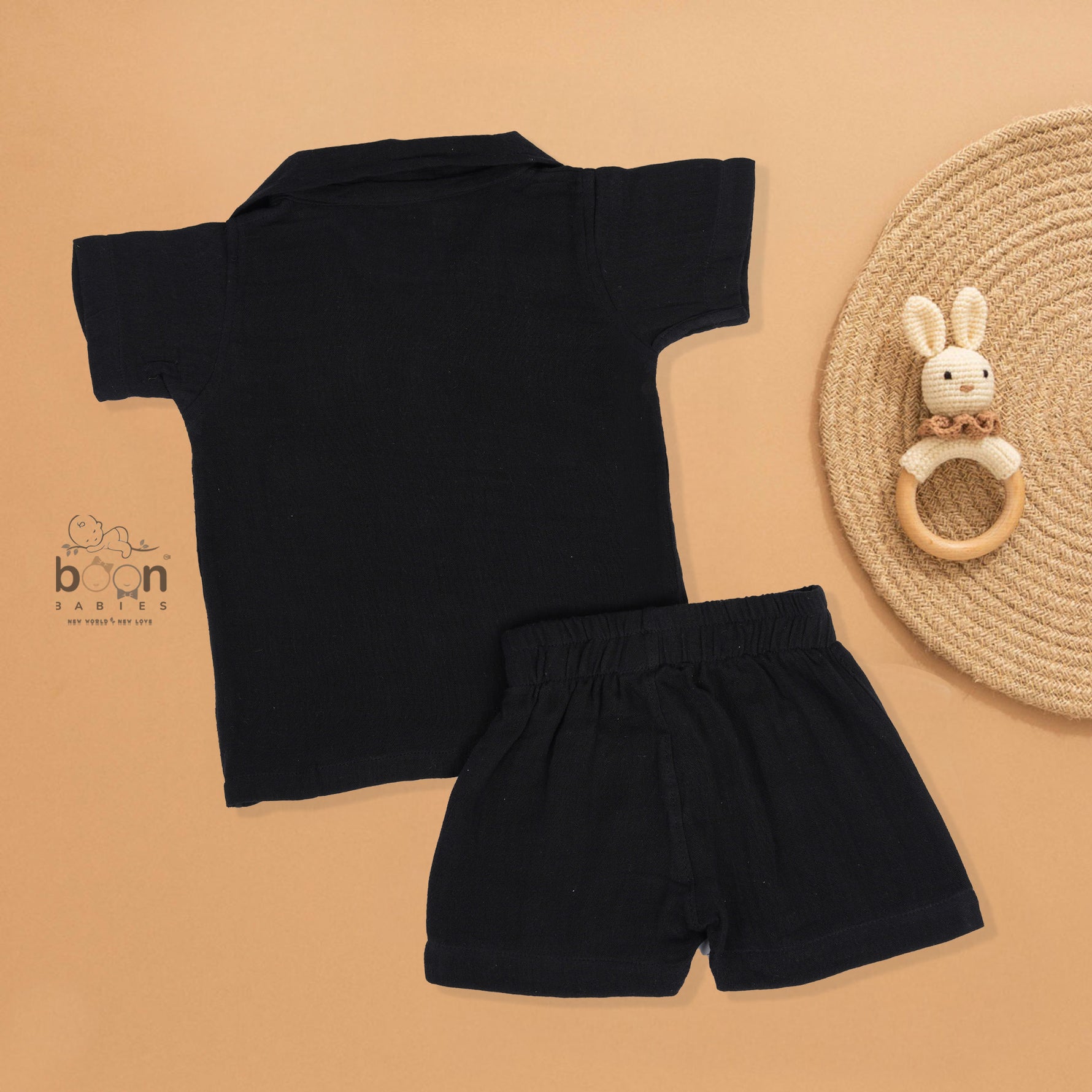 Black crinkle muslin shirt and shorts set for boys featuring lion face embroidery and wooden buttons – breathable toddler outfit by Boon Babies, Coimbatore.
