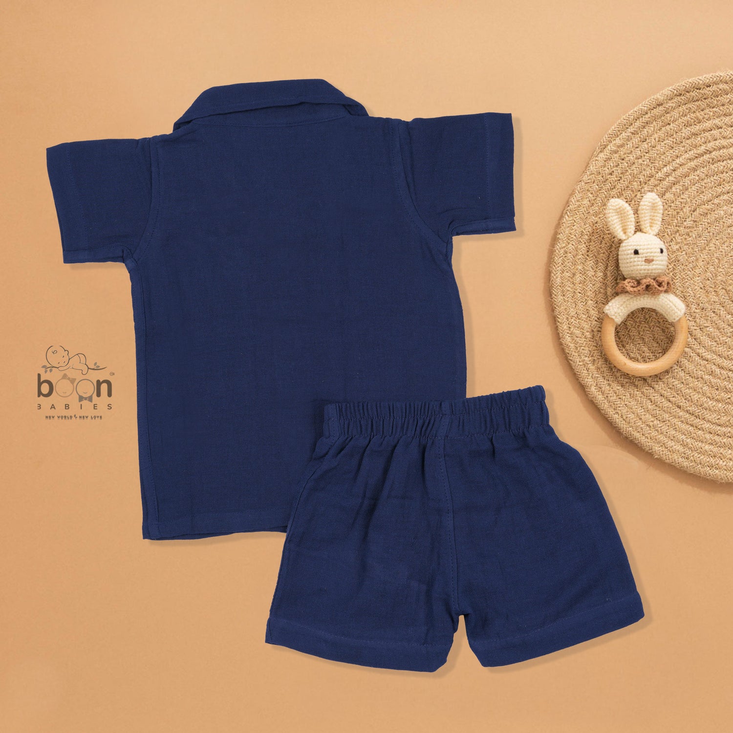 Navy blue crinkle muslin shirt and shorts set for boys with giraffe face embroidery, wooden buttons, and soft shorts – Boon Babies summer outfit from Coimbatore.
