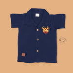 Navy blue crinkle muslin shirt and shorts set for boys with giraffe face embroidery, wooden buttons, and soft shorts – Boon Babies summer outfit from Coimbatore.
