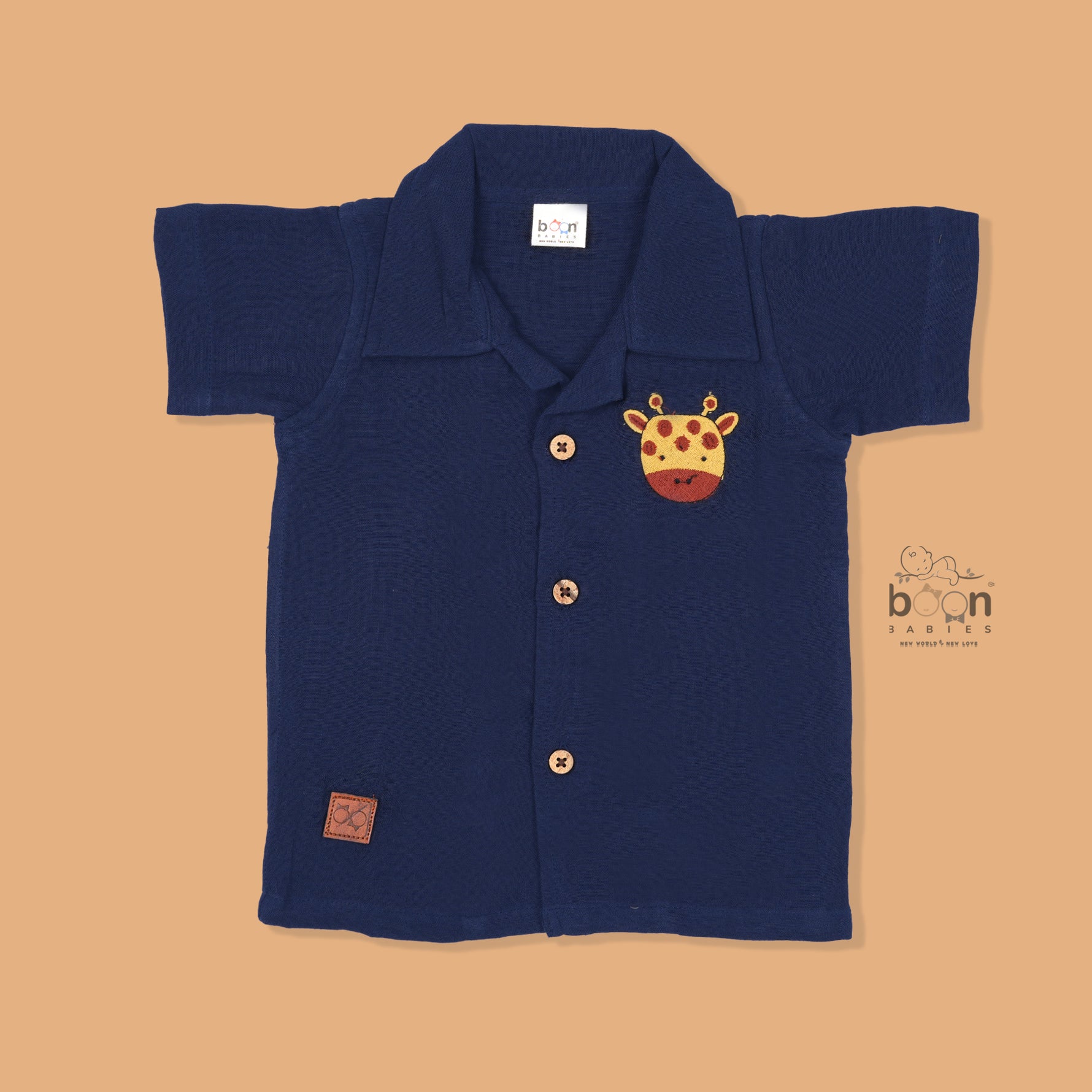 Navy blue crinkle muslin shirt and shorts set for boys with giraffe face embroidery, wooden buttons, and soft shorts – Boon Babies summer outfit from Coimbatore.
