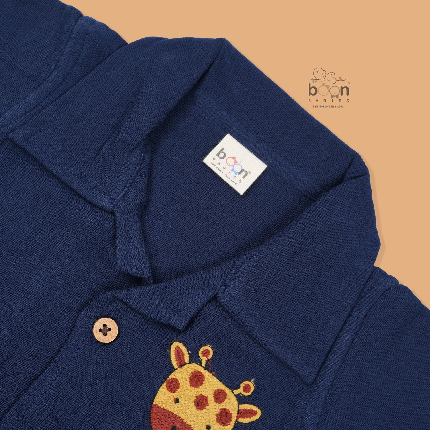 Navy blue crinkle muslin shirt and shorts set for boys with giraffe face embroidery, wooden buttons, and soft shorts – Boon Babies summer outfit from Coimbatore.
