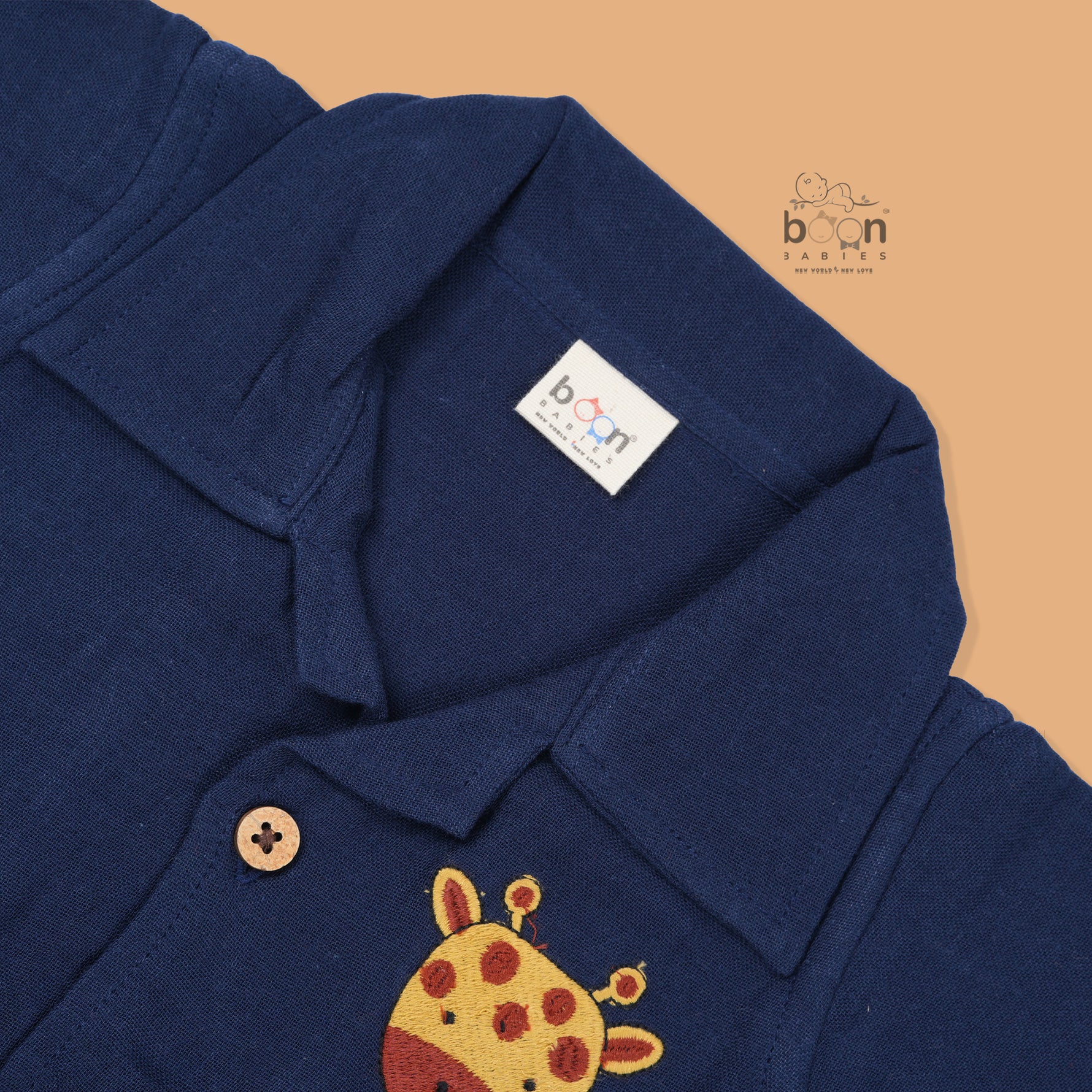 Navy blue crinkle muslin shirt and shorts set for boys with giraffe face embroidery, wooden buttons, and soft shorts – Boon Babies summer outfit from Coimbatore.
