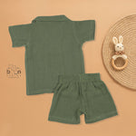 Olive green crinkle muslin shirt and shorts set with giraffe embroidery for boys aged 12M–5Y – a soft, breathable outfit by Boon Babies in Coimbatore.
