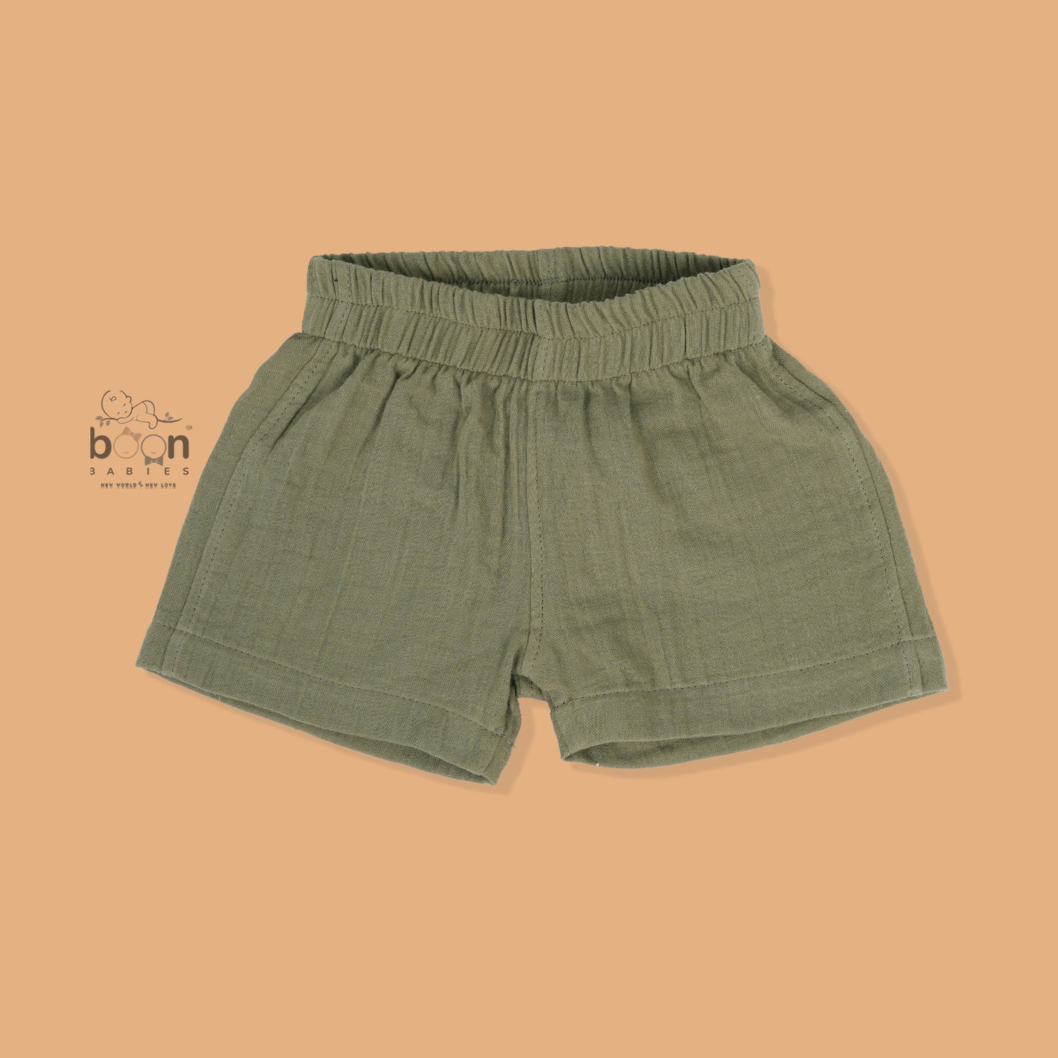 Panda face embroidered crinkle muslin shirt and shorts set in earthy green for boys, featuring an open collar and elastic shorts – from Boon Babies, Coimbatore.
