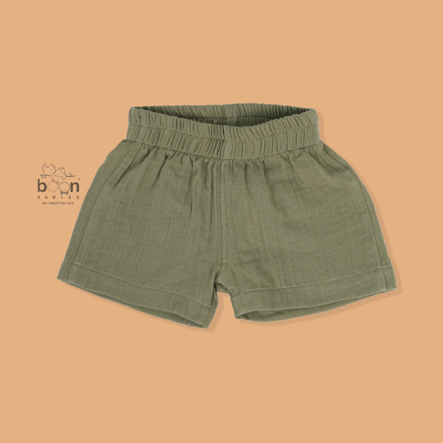 Panda face embroidered crinkle muslin shirt and shorts set in earthy green for boys, featuring an open collar and elastic shorts – from Boon Babies, Coimbatore.

