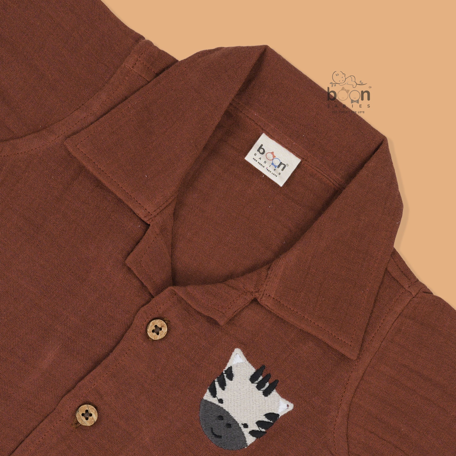 Rust brown crinkle muslin shirt and shorts set with zebra embroidery for boys – soft, breathable kidswear by Boon Babies, Coimbatore.
