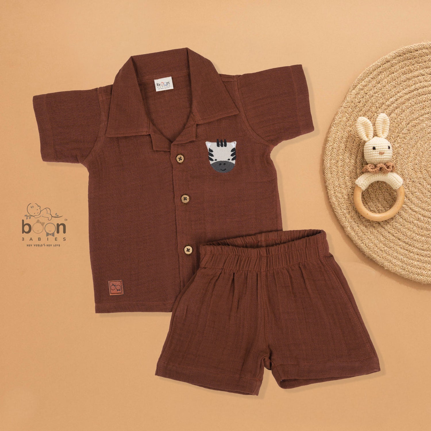 Rust brown crinkle muslin shirt and shorts set with zebra embroidery for boys – soft, breathable kidswear by Boon Babies, Coimbatore.
