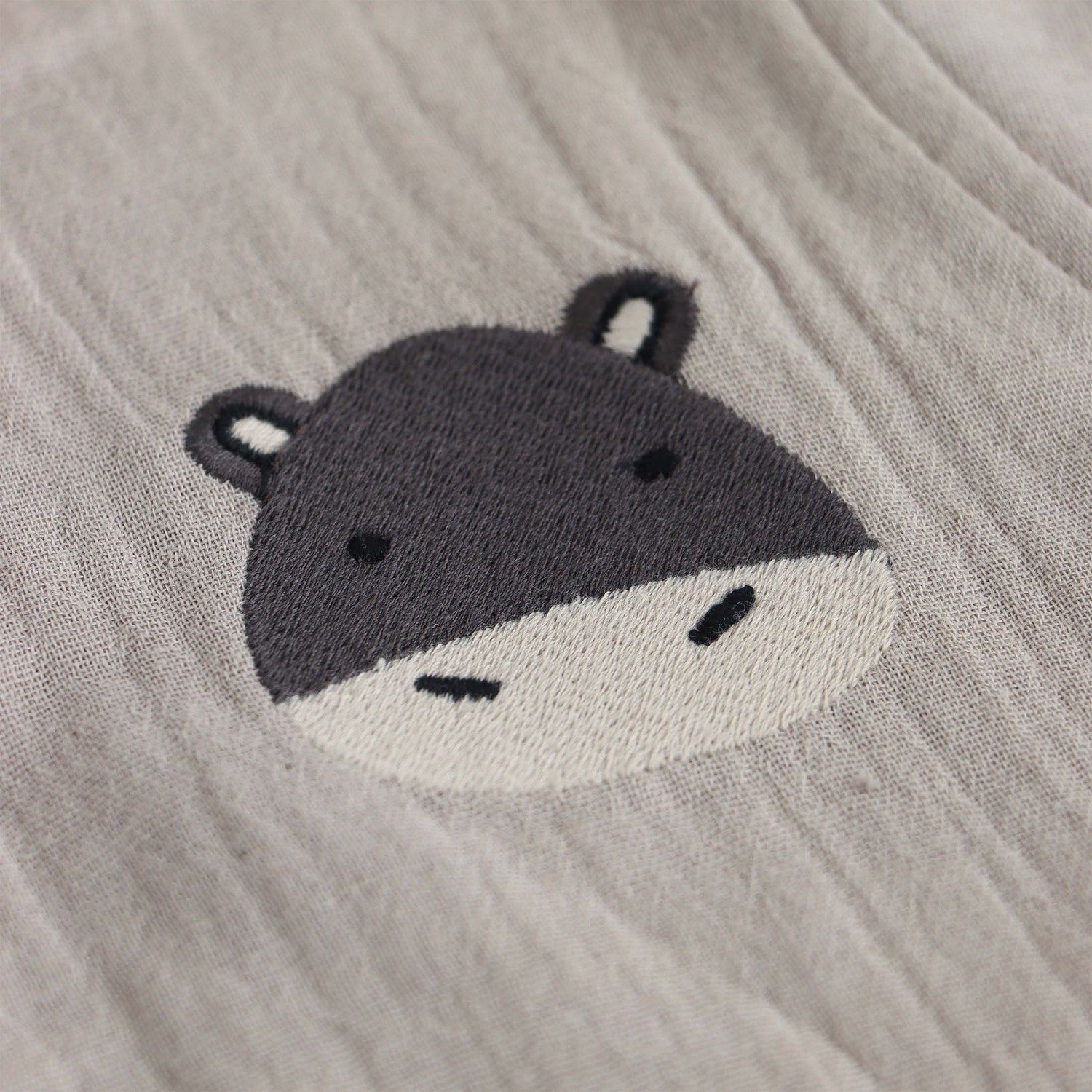 Beige baby boys’ muslin shirt and shorts set with hippo embroidery, made of soft crinkled muslin – Boon Babies eco-friendly summer wear from Coimbatore.
