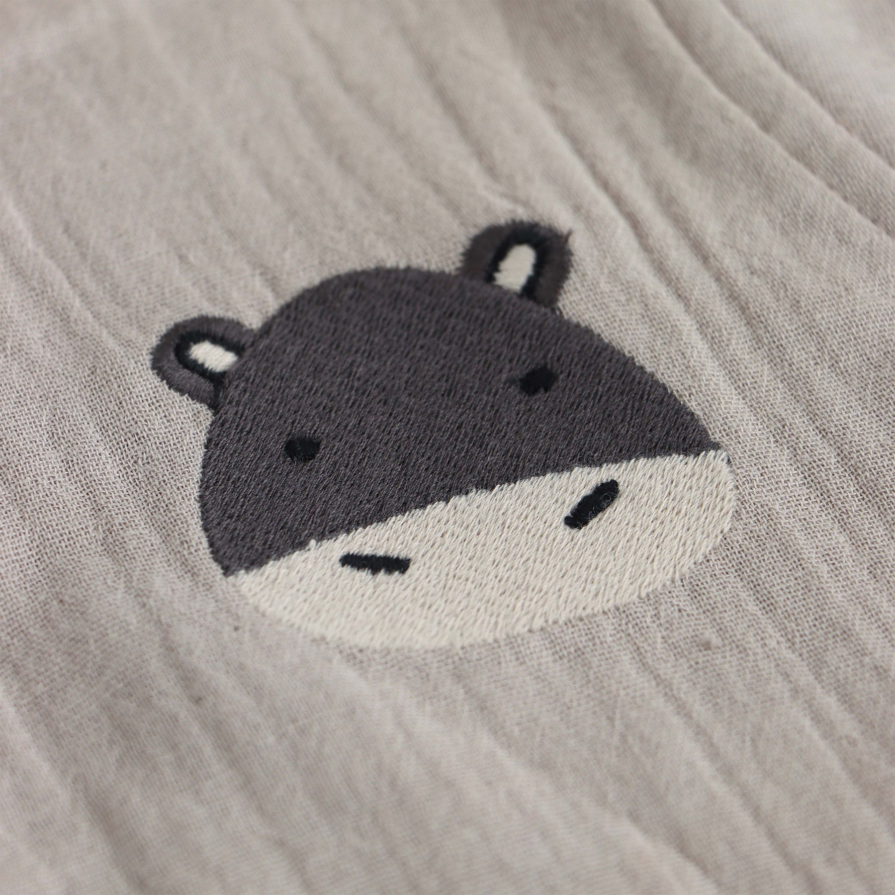 Beige baby boys’ muslin shirt and shorts set with hippo embroidery, made of soft crinkled muslin – Boon Babies eco-friendly summer wear from Coimbatore.
