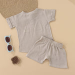 Beige baby boys’ muslin shirt and shorts set with hippo embroidery, made of soft crinkled muslin – Boon Babies eco-friendly summer wear from Coimbatore.
